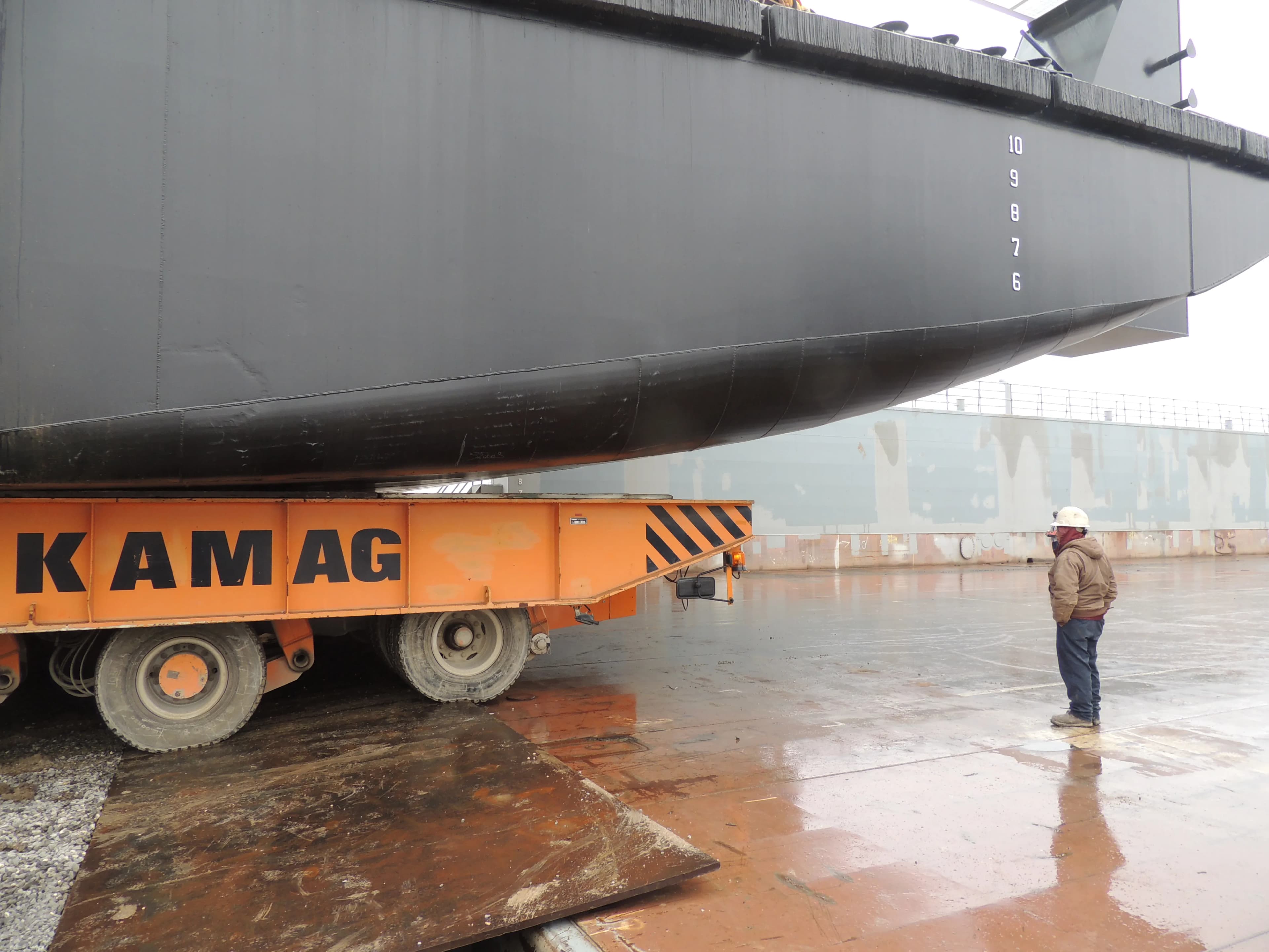 KAMAG transporter moving a barge hull at C&C Marine